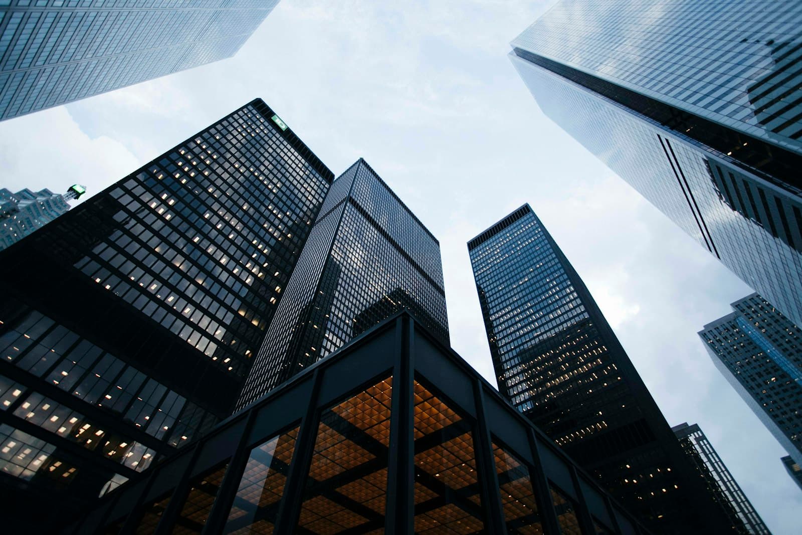 Modern corporate towers under a bright sky